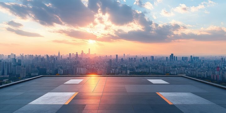 Empty rooftop helipad at sunset overlooking a sprawling city skyline with warm golden light and a calm, serene atmosphere