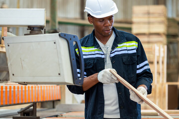 Black people, Carpenter and furniture workshop. African American male carpenter using tools for making furniture from wood in furniture factory. One male carpenter engineer in wood factory.