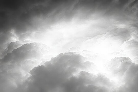 Backlit billowing cumulus clouds filling the sky with bright ethereal light, evoking awe and serene drama