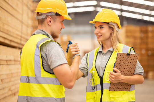 Wood factory worker man having injure at work. Man worker feeling pain in his leg from accident while working in warehouse.. Safety, Industry, Healthcare, Insurance Concept. - Powered by Adobe