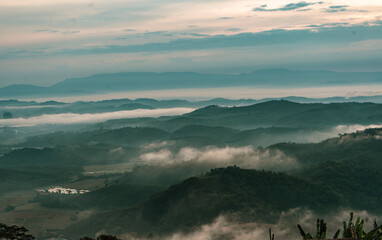 Beautiful Landscape of mountain layer in morning sun ray and winter fog at Doi Hua Mae Kham, Mae Salong Nai, Chiangrai, Thailand