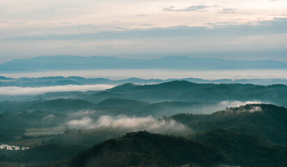 Beautiful Landscape of mountain layer in morning sun ray and winter fog at Doi Hua Mae Kham, Mae Salong Nai, Chiangrai, Thailand
