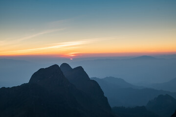 Morning Fog on mountain and sunrise background,Landscape mountain and sunrise background view.