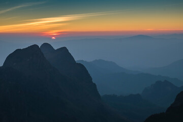 Morning Fog on mountain and sunrise background,Landscape mountain and sunrise background view.