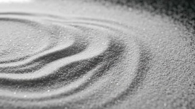 Macro shot in slow motion of fine white grains of sand or dust shifting and forming subtle rolling wave textures across a flat surface organic, flow, movement