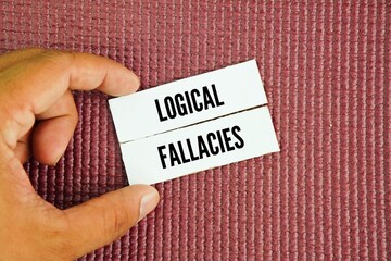 Paper with the word logical fallacies. errors in reasoning that weaken an argument, often by introducing an invalid or irrelevant point that appears logical but lacks evidence.