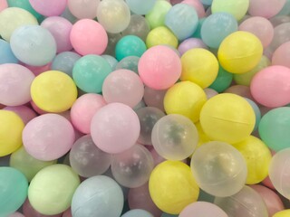 Softly Colored Pastel Plastic Balls Filling a Playful Background