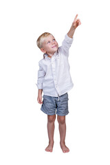 Smiling 5-year-old boy pointing up. Full length. Isolated on white background. Vertical.