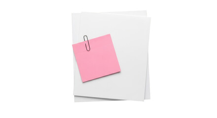 Pink sticky note on a stack of blank white papers held by a paperclip for reminders.