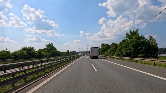 Truck Overtaking on French Highway Under Summer Sky