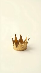 Obraz premium A soft, deflated golden crown lying flat, symbolizing lost power or authority; isolated on a clean white background.