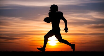 Silhouette of a football player running with the ball against a vibrant sunset sky