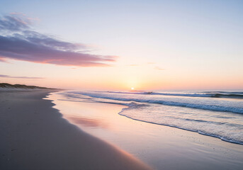 Colorful sunset viewed from the pink sea beach with soft waves