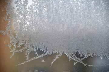 Frosted Glass With Intricate Ice Crystals Creating Delicate Winter Pattern Across Surface