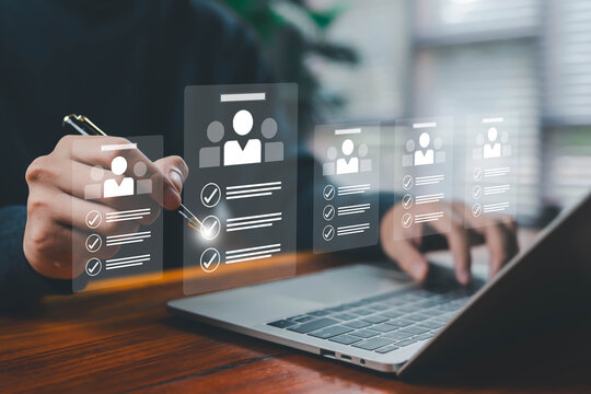 Hands selecting digital candidate profiles on a laptop, symbolizing recruitment, HR management, employee evaluation, hiring process, and talent selection in modern digital workforce systems online job