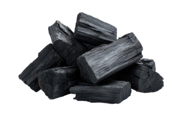A pile of charcoal briquettes, black and textured, isolated on a dark background