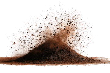 A close-up of a brown material exploding upwards against a black background
