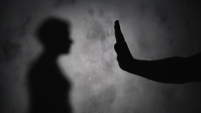 Silhouette of a person offering something to another