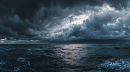 Fototapeta premium Dark clouds fill the sky above a turbulent ocean, creating a dramatic scene at twilight. Waves crash against each other, showcasing nature's powerful forces and rich textures.