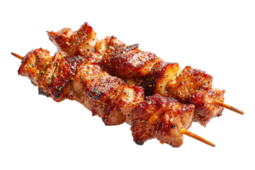 Close-up view of two grilled meat skewers, showing succulent browned pieces on wooden sticks