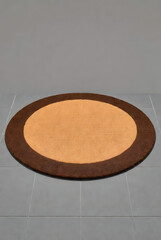 Semi-Circle Coir Doormat with Brown Border on Gray Floor (3D Render)