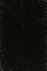 Obraz premium A dark, gritty texture with subtle hints of light. It evokes a feeling of mystery with its rough edges and uneven surface treatment.