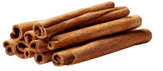 Rustic cinnamon sticks piled together, isolated on black
