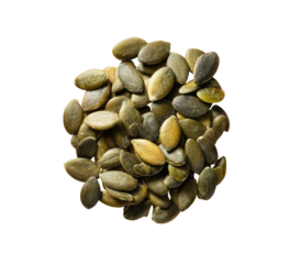 A pile of green and gold pumpkin seeds on a black background