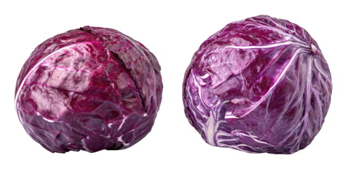 Two vibrant red cabbages on a black background, showing texture