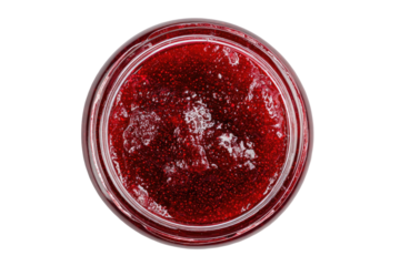 Overhead view of a jar filled with glistening, ruby-red berry preserve