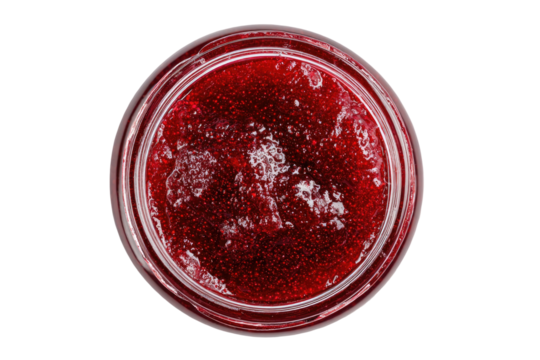 Overhead view of a jar filled with glistening, ruby-red berry preserve