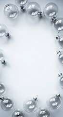 Obraz premium Clear transparent Christmas ornaments framing a clean white background, perfect for minimalist holiday designs and copy space.