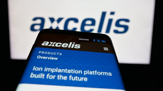 Stuttgart, Germany - 11-07-2025: Mobile phone with website of US company Axcelis Technologies Inc. on screen in front of logo. Focus on top-left of phone display.