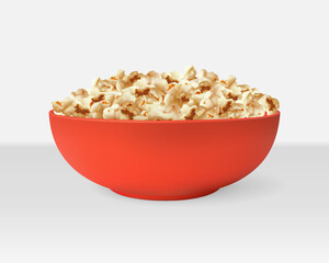 A red realistic bowl with popped popcorn. Food, leisure, entertainment, snack.