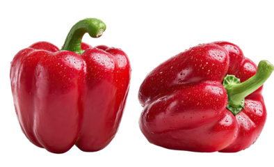 Two vibrant red bell peppers glisteni?ng with water droplets