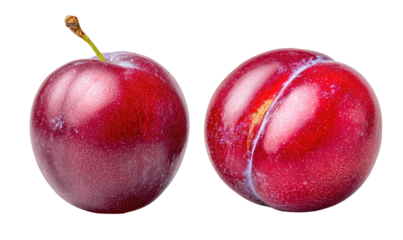 Two ripe, deep red plums with a slight sheen, isolated on black