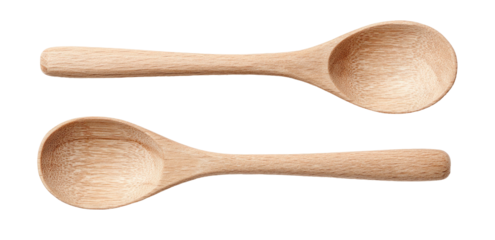Two wooden spoons, one above other, on black background