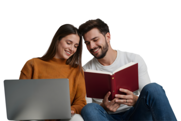 Smiling young couple sitting together on a sofa using a laptop computer at home
