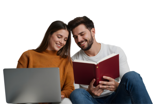 Smiling young couple sitting together on a sofa using a laptop computer at home