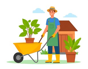 Man in green apron transports plant in wheelbarrow near shed on sunny day