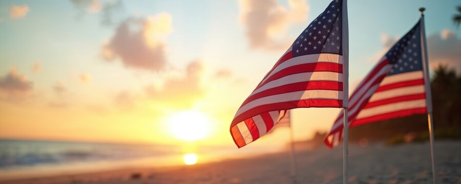 American flags on beach at sunset. USA holiday concept with waving stars and stripes. Beach celebration at dusk time. Summer vacation at the ocean.