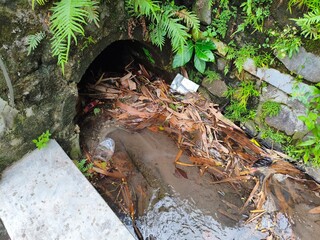 piles of rubbish in the gutters can cause flooding
