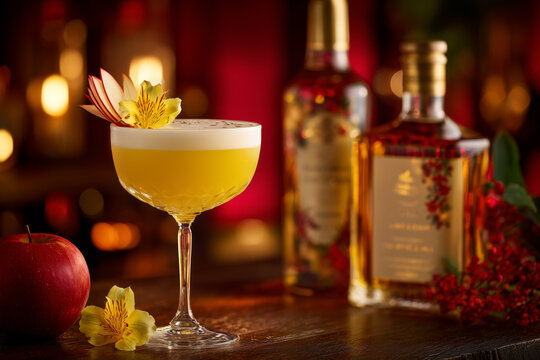 Elegant apple cocktail with floral garnish for upscale bar promotions and holiday celebrations, perfect for festive menus and sophisticated events