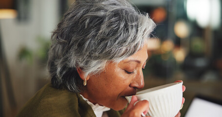 Coffee, drinking and mature businesswoman in office in morning for calm, relax or career at...