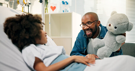Boy, father and happy for teddy in hospital bed, present and care with support for recovery. Black...