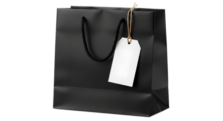A plain black shopping bag with a blank white tag hanging from its handle, isolated on a transparent background