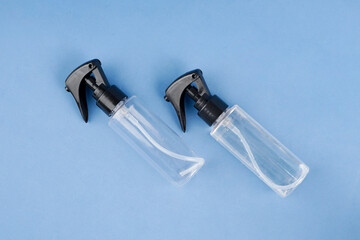 Two room freshener sprays are placed on a blue background, creating a clean and refreshing look