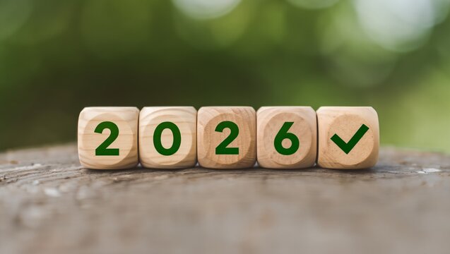 Wooden blocks displaying the year 2026 with a checkmark