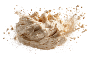 Tan fluid explodes, droplets spraying on a black background