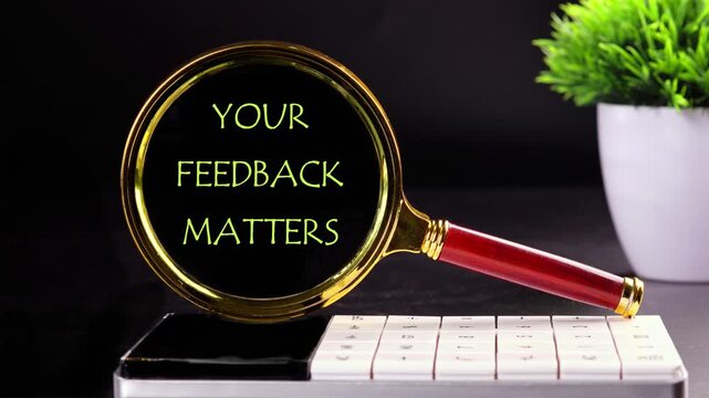 Your feedback is important concept, Animation of the conceptual text of YOUR FEEDBACK MATTERS, through a magnifying glass on a black background